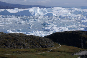 Melting icebergs crowd the Ilulissat Icefjord on July 13 near Ilulissat, Greenland. Credit: Sean Gallup/Getty Images