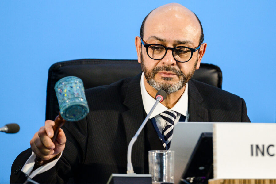 Luis Vayas Valdivieso, chair of the U.N. Intergovernmental Negotiating Committee on Plastic Pollution, marks an agreement that treaty talks will resume at a later date during the fifth session of the committee on Dec. 2 in Busan, South Korea. Credit: Anthony Wallace/AFP via Getty Images