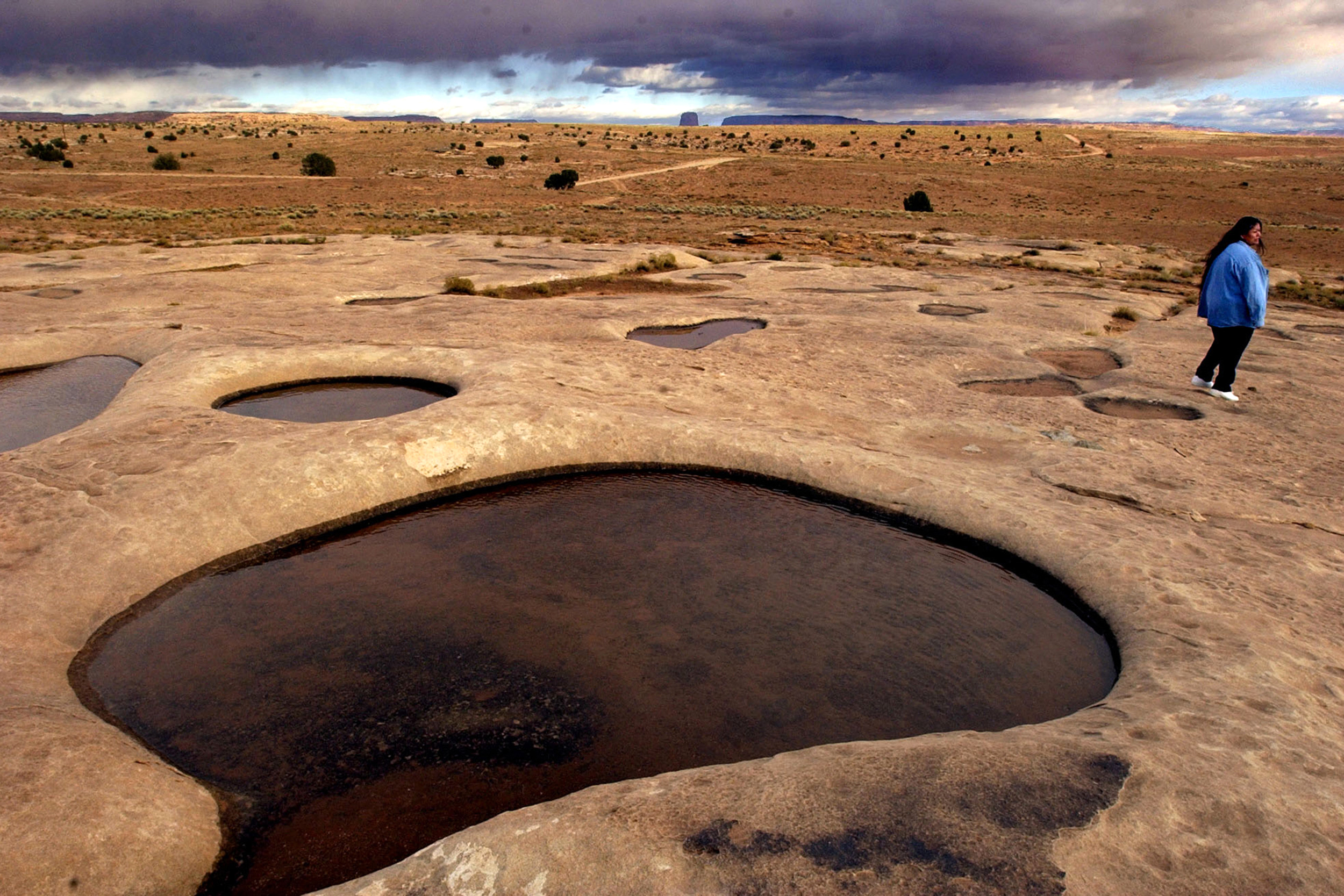 Susan Black, who lost her son to Navajo neuropathy, drank from these open pits during her pregnancy while sheep herding near uranium mining. Mariane Paviasen in Greenland researched such mining in the Navajo Nation as she tried to learn about the possible effects of a rare earth mine that has uranium mixed in. Credit: Gail Fisher/Los Angeles Times via Getty Images