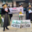 Members of the Delaware Riverkeeper Network lean into the release of the movie "Wicked" to protest outside a green hydrogen conference in Philadelphia on Nov. 19. Credit: Kyle Bagenstose/Inside Climate News