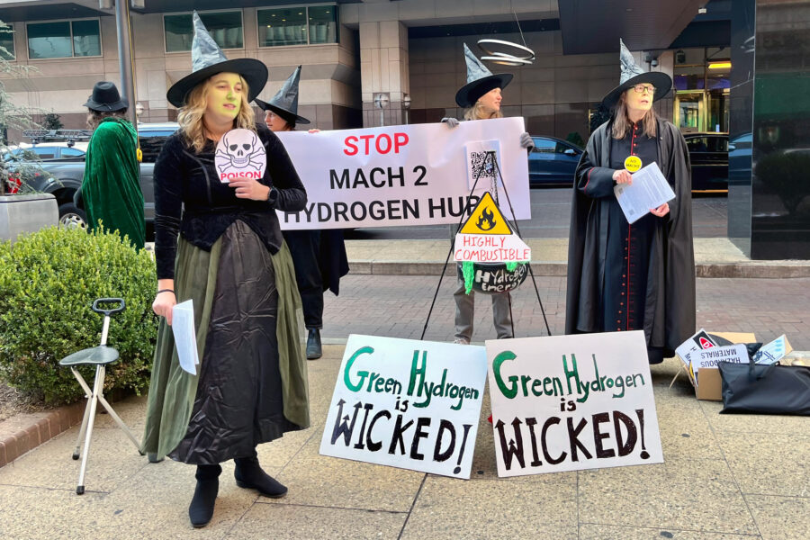 Members of the Delaware Riverkeeper Network lean into the release of the movie "Wicked" to protest outside a green hydrogen conference in Philadelphia on Nov. 19. Credit: Kyle Bagenstose/Inside Climate News