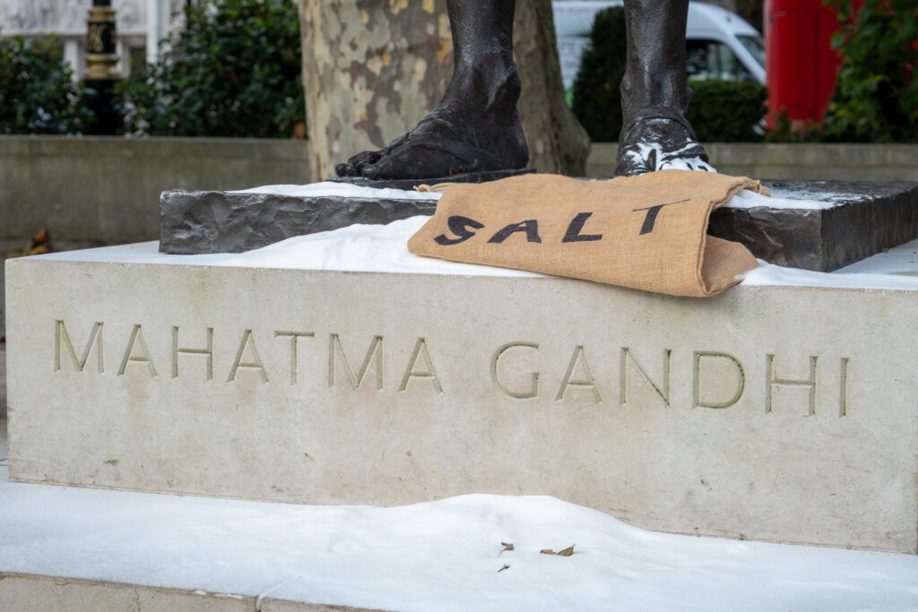 On Nov. 1, activists with Just Stop Oil poured sugar, representing salt, on a statue of Mahatma Gandhi in an attempt to illustrate the hypocrisy of Britain celebrating civil disobedience in the past while targeting it in the present. Credit: Keerti Gopal/Inside Climate News