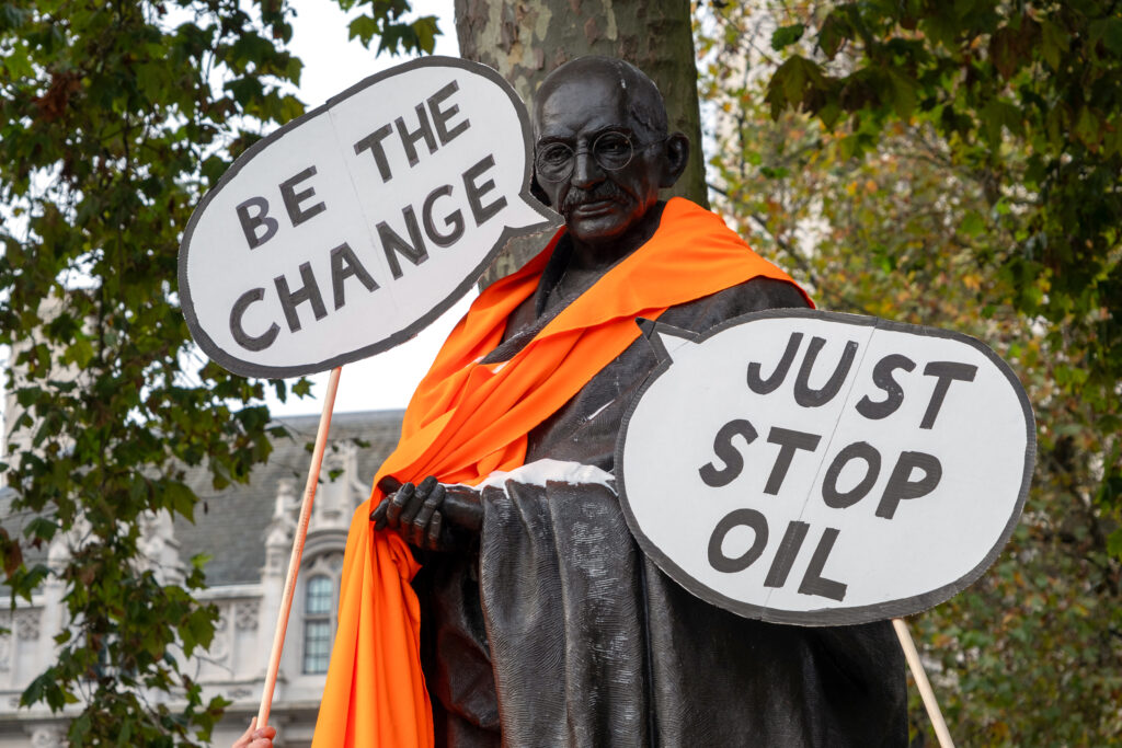 On Nov. 1, activists with Just Stop Oil poured sugar, representing salt, on a statue of Mahatma Gandhi in an attempt to illustrate the hypocrisy of Britain celebrating civil disobedience in the past while targeting it in the present. Credit: Keerti Gopal/Inside Climate News