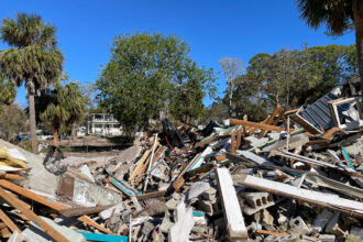 Large piles of debris remained in Cedar Key, Fla., some two months after Hurricane Helene hit. Credit: Amy Green/Inside Climate News