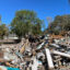 Large piles of debris remained in Cedar Key, Fla., some two months after Hurricane Helene hit. Credit: Amy Green/Inside Climate News