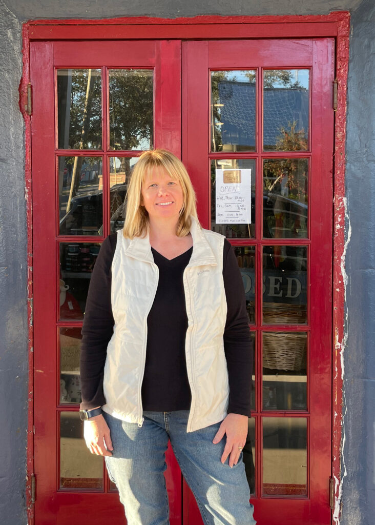 Caryn Stephenson is engaged in multiple businesses in Cedar Key, including two gift shops. The shops reopened within weeks after Helene. Now the problem is customers, she said. Credit: Amy Green/Inside Climate News