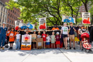 A group with the Summer of Heat on Wall Street campaign stages a children's memorial at Citibank’s Manhattan headquarters and CEO Jane Fraser's home on July 27, 2024, to highlight children displaced by climate change. Credit: Keerti Gopal/Inside Climate News