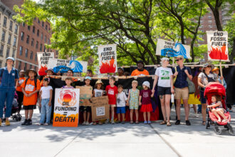 A group with the Summer of Heat on Wall Street campaign stages a children's memorial at Citibank’s Manhattan headquarters and CEO Jane Fraser's home on July 27, 2024, to highlight children displaced by climate change. Credit: Keerti Gopal/Inside Climate News
