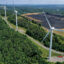 An aerial view of wind turbines on the spine of Backbone Mountain next to a coal processing plant in Oakland, Md. Credit: Chip Somodevilla/Getty Images