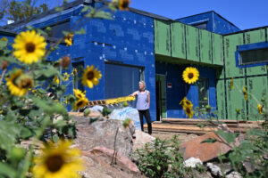 Susan Nedell stands outside her home that is being rebuilt after it burned in the Marshall fire on Aug. 28, 2023 in Louisville, Colo. Credit: RJ Sangosti/MediaNews Group/The Denver Post via Getty Images