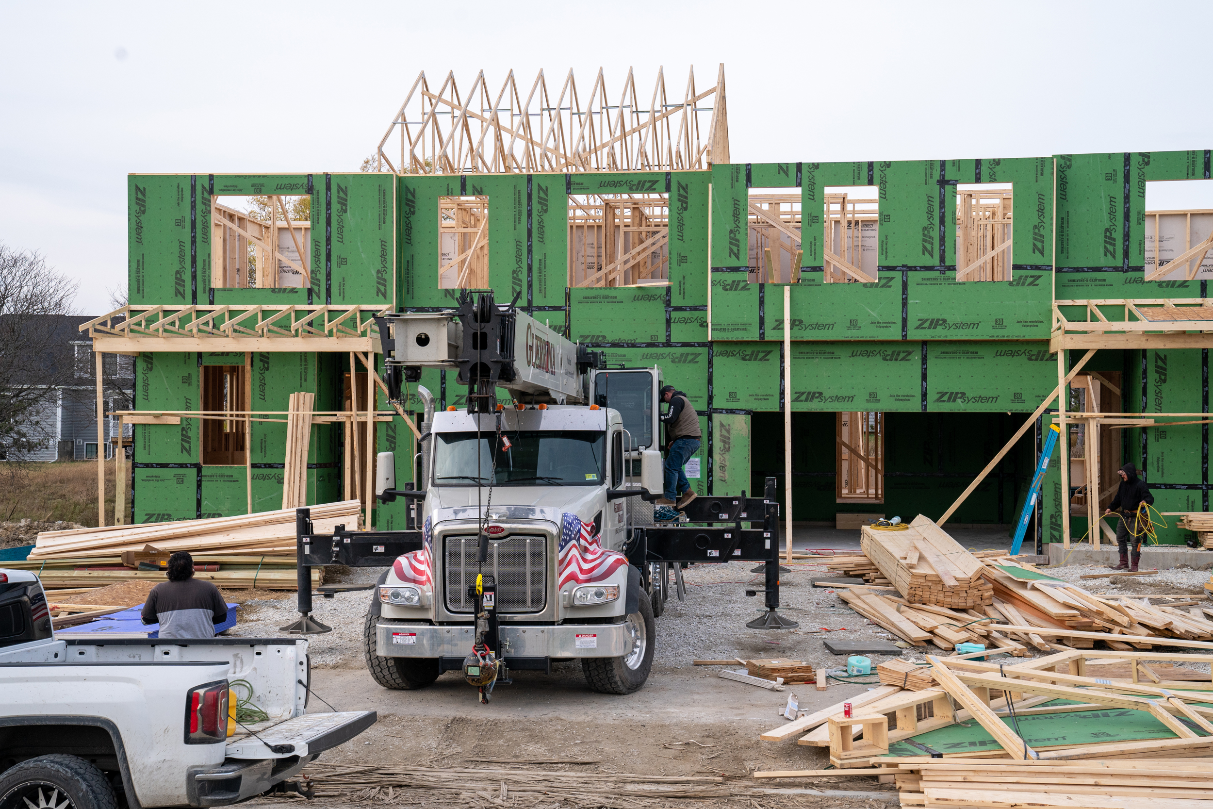 A construction crew works to build a two-family house in Shelburne, Vt. Credit: Robert Nickelsberg/Getty Images