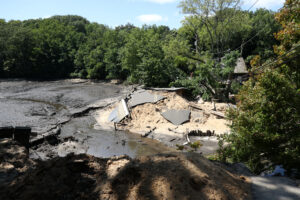 A view of the severely damaged Mill Pond Dam on Aug. 20, 2024, after flooding rains in Stony Brook, New York. Credit: James Carbone/Newsday RM via Getty Images