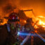 Firefighters fight flames from the Palisades Fire burning the Theatre Palisades during a powerful windstorm on Jan. 8 in Los Angeles. The fast-moving wildfire is threatening homes in the coastal Pacific Palisades neighborhood amid intense Santa Ana winds and dry conditions in Southern California. Credit: Apu Gomes/Getty Images