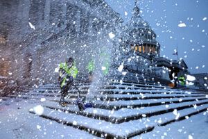 Crews work before dawn to clear snow from the steps of the U.S. Capitol on Jan. 6 as a winter storm hits Washington, D.C. Credit: Chip Somodevilla/Getty Images