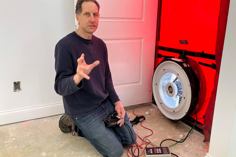 Dwayne Petko, owner and operator of Energy Matters LLC, conducts a blower door test to check for building air leaks in Sunbury, Ohio. Credit: Dan Gearino/Inside Climate News