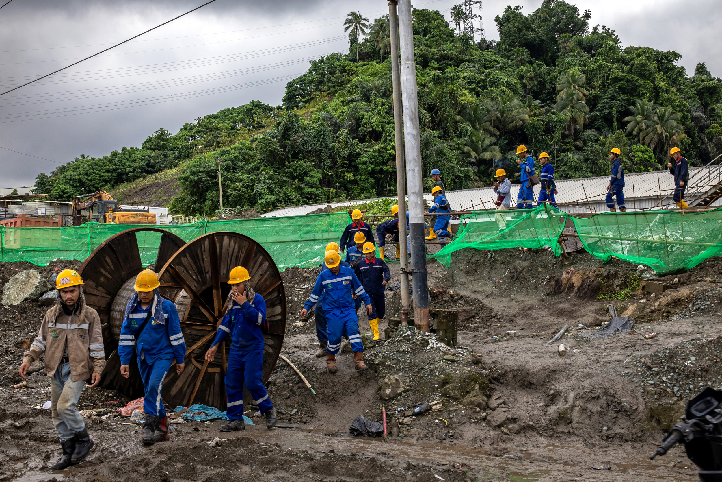 PT Weda Bay Nickel employees take a break while working at the the Indonesia Weda Industrial Park in Central Halmahera on Aug. 14, 2024.