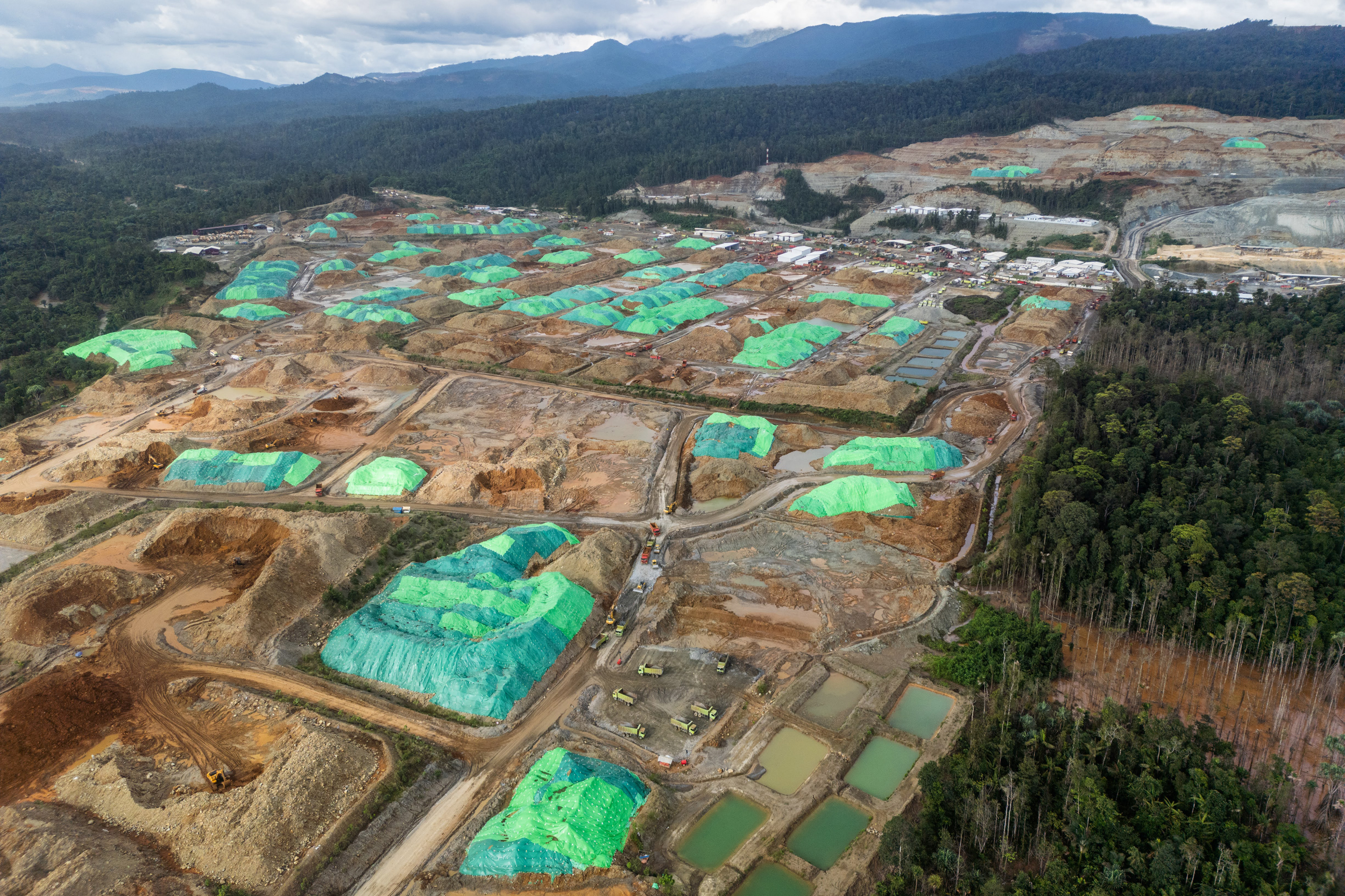 Massive nickel mines operated by different companies occupy land cleared of forest in Central Halmahera.