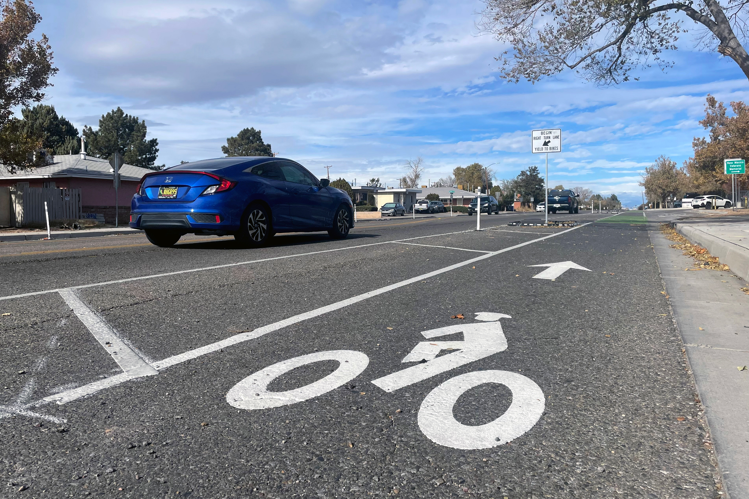 A buffered bike lane on Louisiana Avenue in Albuquerque's International District brings cycling infrastructure to an underserved community. Credit: Tina Deines/Inside Climate News