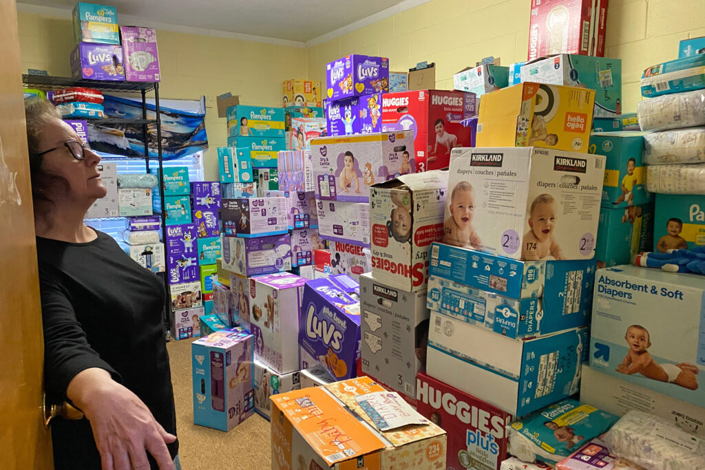 Pastor Ramona Nix stands in a room of donated supplies at Eagle Rock Church in Swannanoa, N.C. Credit: Lisa Sorg/Inside Climate News