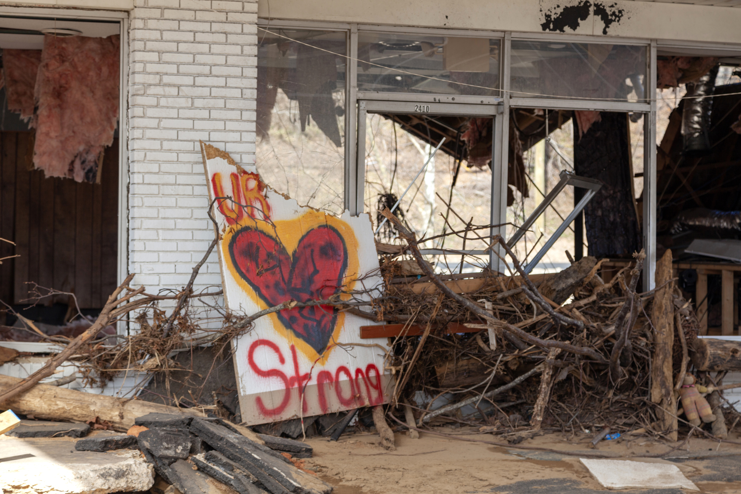 Four months after Helene devastated Swannanoa, debris is still strewn everywhere. Credit: Lisa Sorg/Inside Climate News