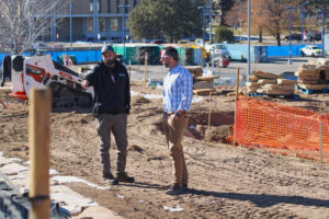Chris Bowers (right) surveys a site where nonfunctional turf is being replaced on the University of Northern Colorado campus on Jan. 15. The landscaping change will bring water use on that patch of campus down from about 3 million gallons each year to 1 million. Credit: Alex Hager/KUNC