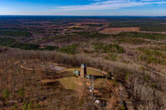 An aerial view of the tower built by the Civilian Conservation Corps at the top of Flagg Mountain in Alabama. Credit: Lee Hedgepeth/Inside Climate News