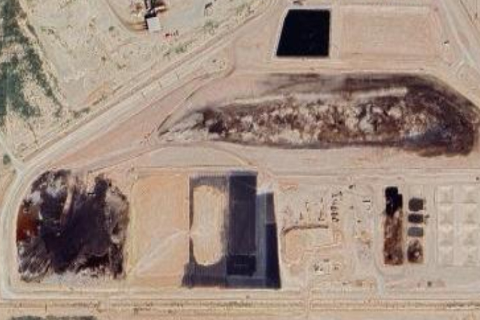 Google satellite images show oilfield waste pits in the Permian Basin of Texas. These pits can cover several acres. Once the well is completed the waste is buried underground permanently. Credit: Google