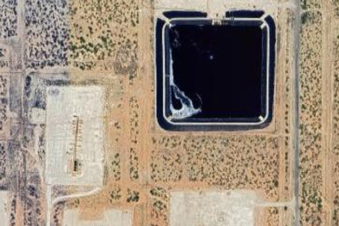 Google satellite images show oilfield waste pits in the Permian Basin of Texas. These pits can cover several acres. Once the well is completed the waste is buried underground permanently. Credit: Google