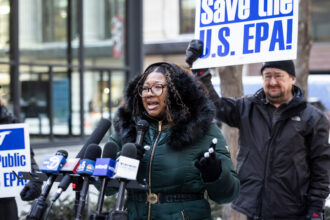 Nyla McCranie, a probational employee who was fired Friday from the Environmental Protection Agency, speaks Tuesday at a rally in Federal Plaza held to protest President Donald Trump’s targeting of the agency. Credit: Ashlee Rezin/Sun-Times