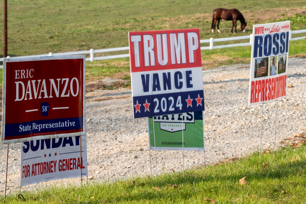 Conservative yard signs are displayed on a small farm in Yukon, Pa. Credit: Scott Goldsmith/Inside Climate News