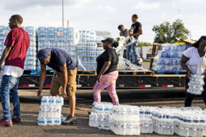 Volunteers hand out bottled water on Aug. 31, 2022, as Jackson, Miss. residents are left without safe drinking water after a treatment plant failed. Credit: Brad Vest/Getty Images
