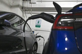 EVs charge at a station in Virginia. Credit: Celal Gunes/Anadolu Agency via Getty Images