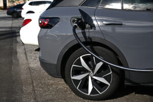 An electric vehicle charges at a shopping mall parking lot in Torrance, Calif. Credit: Patrick T. Fallon/AFP via Getty Images