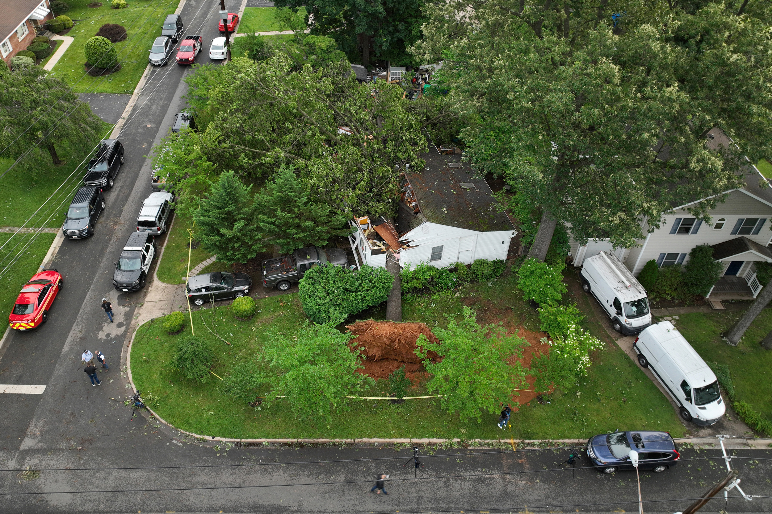 A home is damaged by a fallen tree after a tornado hit Gaithersburg, Md. in June last year. Credit: Chip Somodevilla/Getty Images