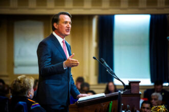 Virginia Gov. Glenn Youngkin addresses the General Assembly during his State of the Commonwealth speech on Jan. 13. Credit: John C. Clark/The Washington Post via Getty Images