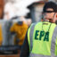 An EPA representative works in a residential area which burned during the Palisades Fire on Jan. 28 in Los Angeles. Credit: Mario Tama/Getty Images