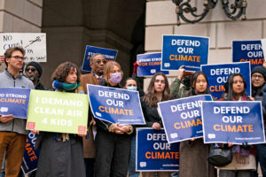 Environmental justice advocates hold signs during a demonstration following Sen. Edward Markey (D-Mass.) being blocked from entering the EPA headquarters on Feb. 6 in Washington, D.C. Credit: Al Drago/Getty Images