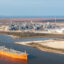 A cargo ship passes the Cheniere Energy liquefied natural gas plant on Feb. 10 in Port Arthur, Texas. Credit: Brandon Bell/Getty Images