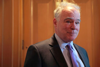 Sen. Tim Kaine (D-Va.) speaks to reporters outside of the Senate Chambers on Feb. 13 in Washington, D.C. Credit: Anna Moneymaker/Getty Images