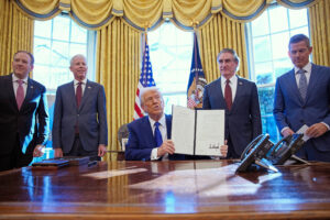 President Donald Trump signs executive orders in the Oval Office on Feb. 14. Trump was joined by (from left) EPA Administrator Lee Zeldin, Energy Secretary Chris Wright, Interior Secretary Doug Burgum and Transportation Secretary Sean Duffy. Credit: Andrew Harnik/Getty Images