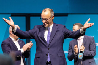 Friedrich Merz, chancellor candidate of Germany’s Christian Democratic Union, reacts after his speech during an election campaign stop on Feb. 20 in Berlin. Credit: Maja Hitij/Getty Images
