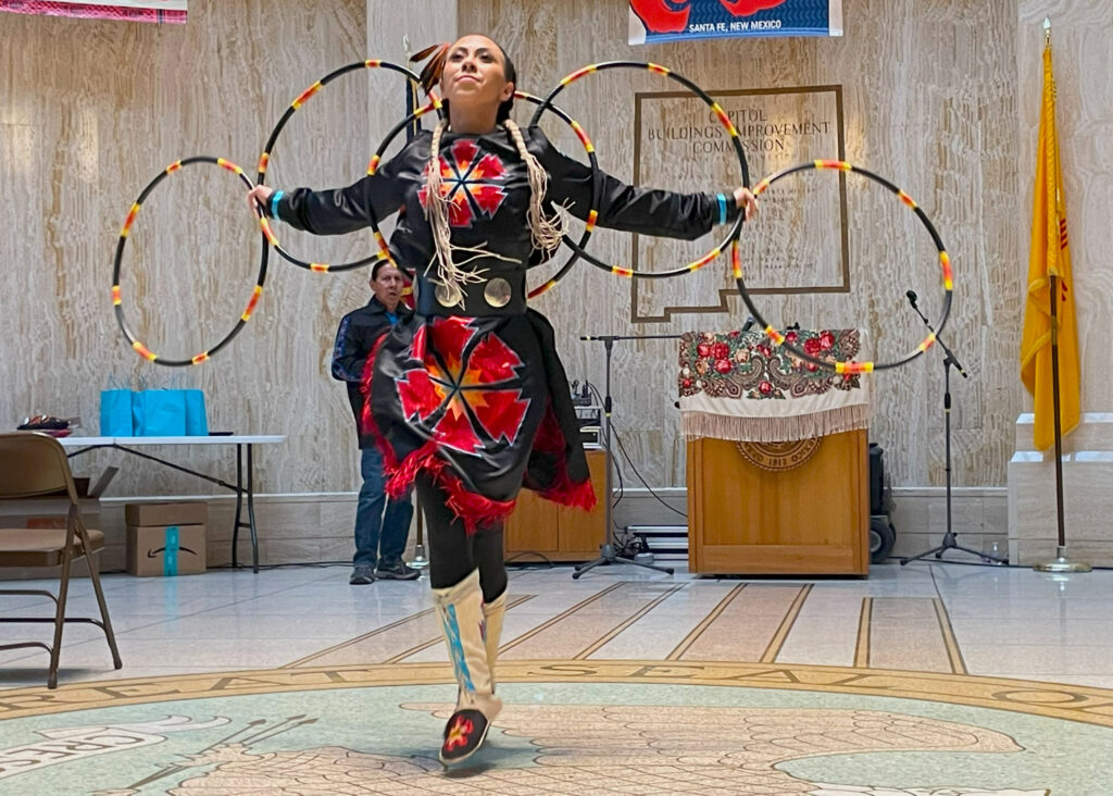 Emileah Misty Rain Flower Lujan, of Taos Pueblo, told attendees at Indigenous Women’s Day that hoop dancing helped her understand her existence as an Indigenous woman. Credit: Noel Lyn Smith/Inside Climate News