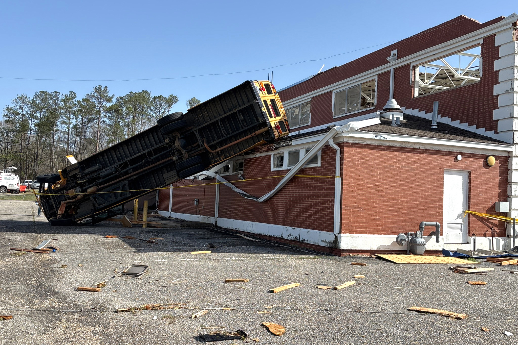 A school bus was thrown onto the roof of the former Winterboro High School building in Talladega County, Ala. during this weekend's severe weather. Credit: Courtesy of NWS Birmingham