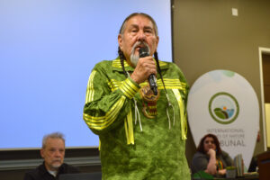 Judge Tom Goldtooth addresses the 6th International Rights of Nature Tribunal on Feb. 28 in Toronto, Canada. Goldtooth noted that people around the world are starting to reevaluate colonial legal systems. Credit: Courtesy of the Global Alliance for the Rights of Nature