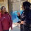 Arieann Harrison talks with longtime Hunters Point resident Antoine Mahan about his concern that truck traffic to and from the Hunters Point Naval Shipyard may be worsening air quality along Innes Avenue, where he lives. Credit: Audrey Mei Yi Brown/San Francisco Public Press