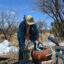 Cheridyn Egan washes a collard green at Borderlands Restoration Network’s Borderlands Earth Care Center on March 3 in Patagonia, Ariz. Credit: Wyatt Myskow/Inside Climate News