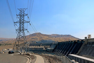 Transmission lines connect power generated by water turbines at the Grand Coulee Dam to the grid in Washington state. Credit: Don and Melinda Crawford/Education Images/Universal Images Group via Getty Images