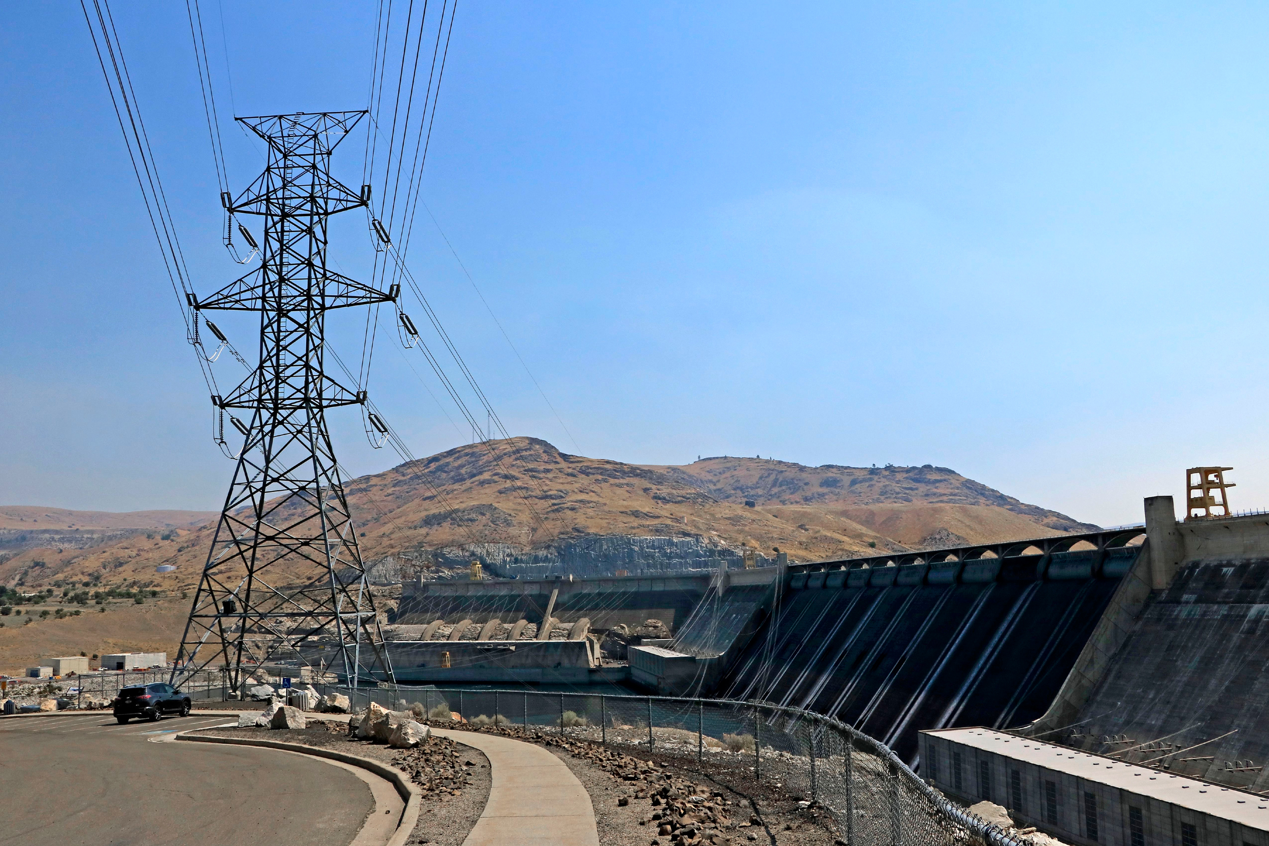 Transmission lines connect power generated by water turbines at the Grand Coulee Dam to the grid in Washington state. Credit: Don and Melinda Crawford/Education Images/Universal Images Group via Getty Images