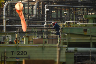 A worker at Chevron’s oil refinery on Jan. 26, 2022 in El Segundo, Calif. Credit: Patrick T. Fallon/AFP via Getty Images