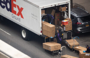 The image shows the back of the truck, which is open and boxes are visible everywhere